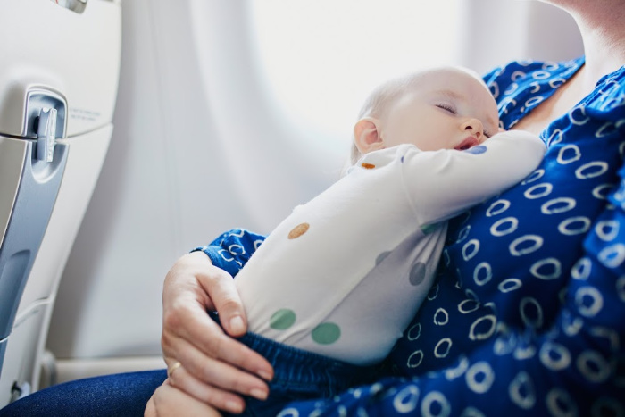 sleeping baby in airplane