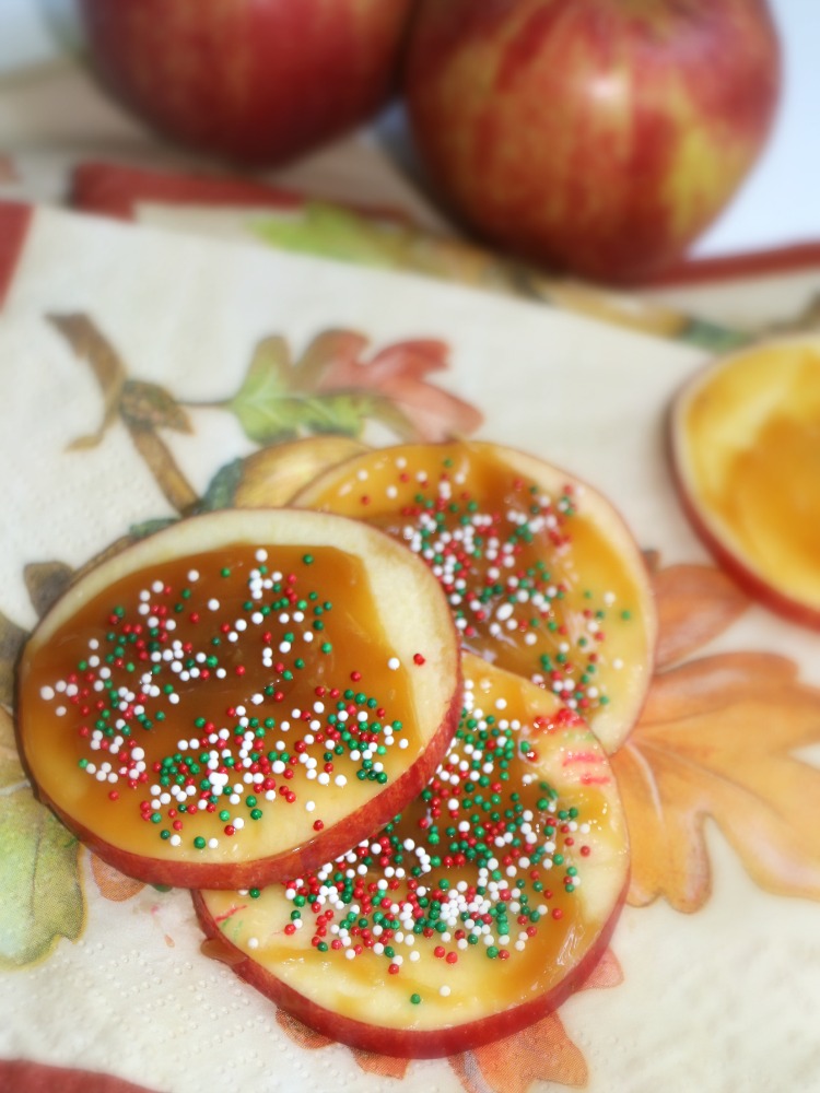 One of the EASIEST apple recipes for the Fall! Top apple slices with caramel and sprinkles for a delicious snack idea your kids will love!